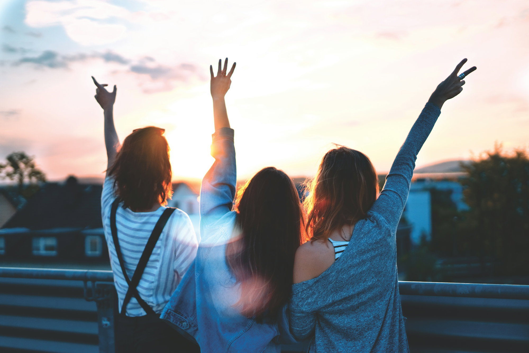 ></picture></div></div><div id= photo of three women lifting there hands \